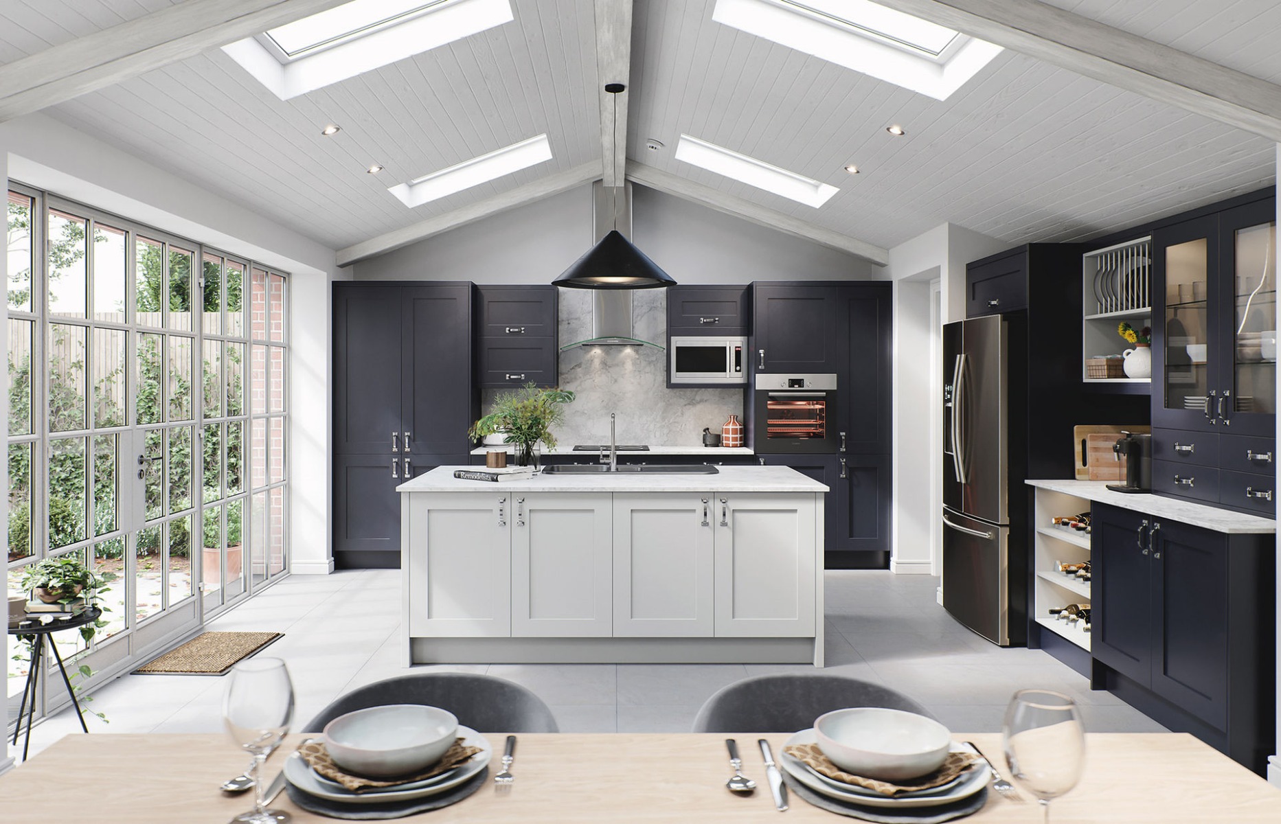 The Oxford kitchen in indigo — a deep navy shaker beneath a vaulted, light-filled ceiling